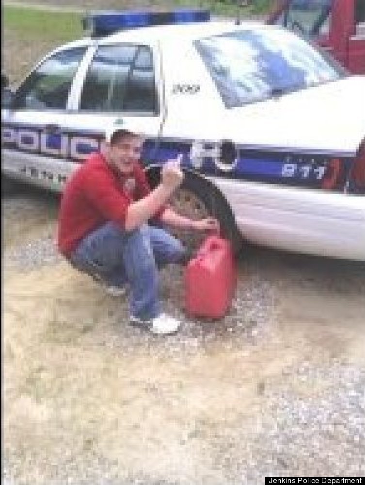 Michael Baker was arrested after posting a Facebook photo of himself stealing gas from a police car in Jenkins, Ky.