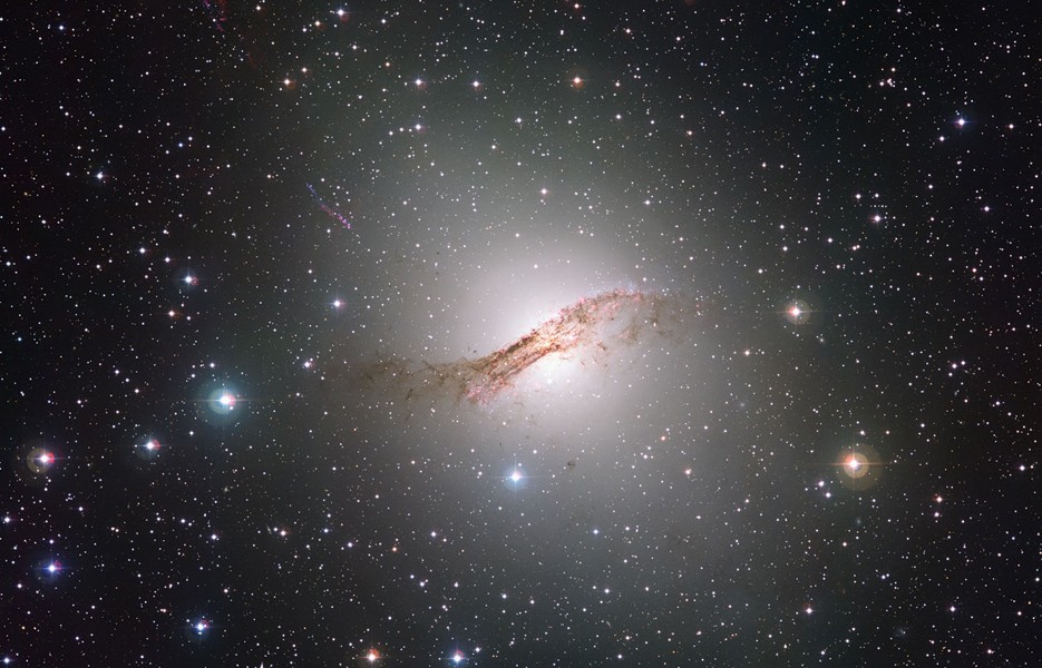 Centaurus A is a massive elliptical galaxy with a supermassive black hole at its heart. It's about 12 million light years away in the southern constellation of Centaurus.