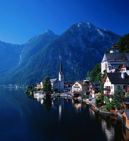 The tiny town of Hallstatt in the Salzkammergut region of Austria, seen from the ferry ride across Lake Hallstatt.
