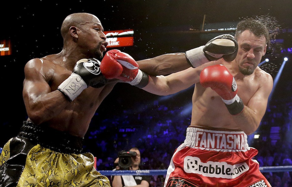 Floyd Mayweather Jr. lands a left jab against Robert Guerrero in the fifth round during a WBC welterweight title fight,