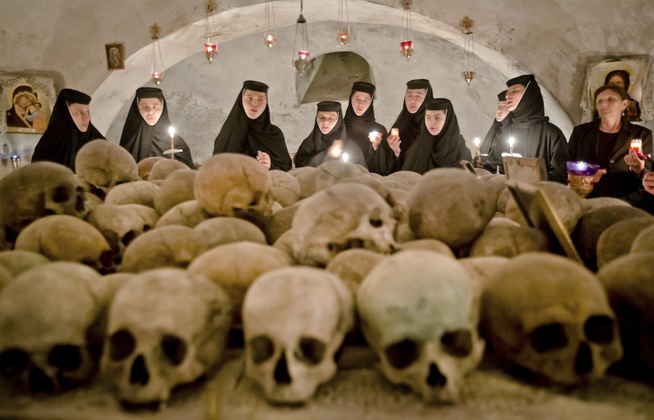 Romanian orthodox nuns sing in the ossuary at the Pasarea monastery, outside Bucharest, Romania,