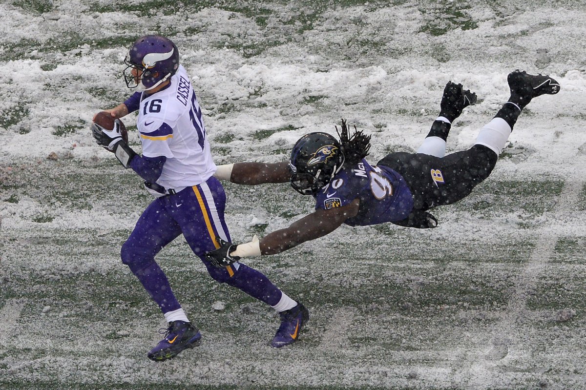 A Ravens defender dives at Vikings quarterback Matt Cassel.