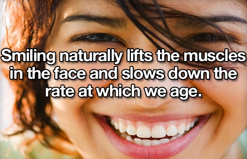woman face happy - Smiling naturally lifts the muscles in the face and slows down the rate at which we age.