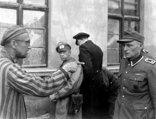 Russian slave laborer among prisoners liberated by 3rd Armored Division points out fromer Nazi guard who brutally beat prisoners. Germany, April 14, 1945