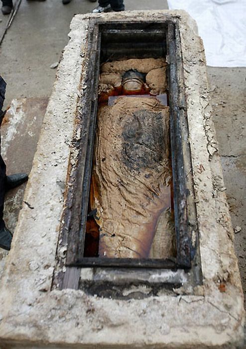 A female mummy was found inside the wooden box coffin.