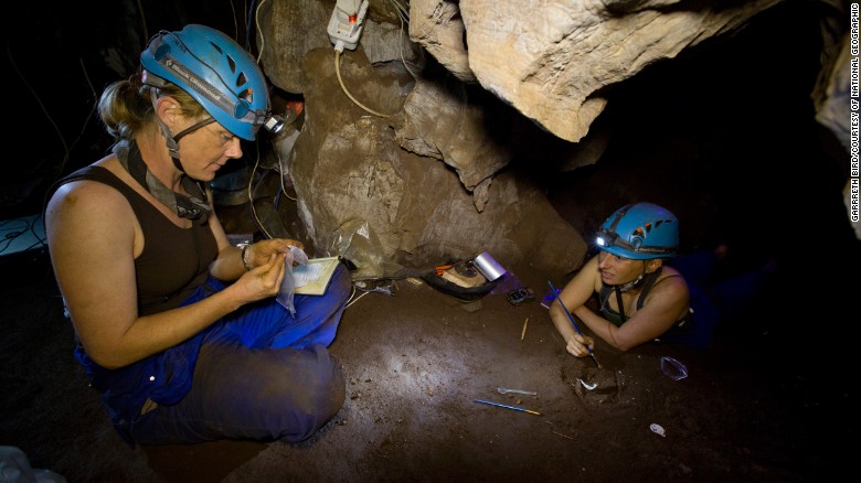 Marina Elliott and Becca Peixotto working inside the cave where the remains were found.