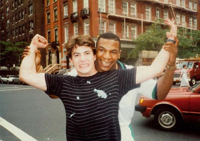 Robert Downy Jr poses with his father's friend, Mike Tyson.