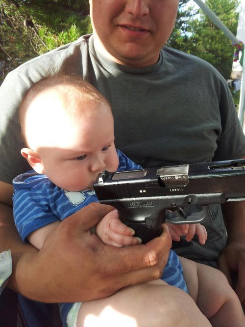 parenting fails - child holding gun - COB911