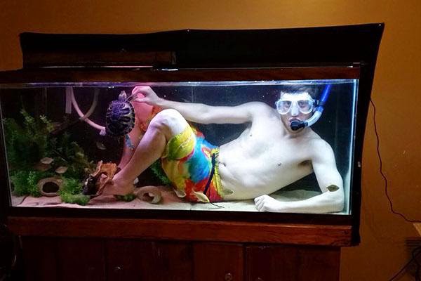 guy in a fish tank