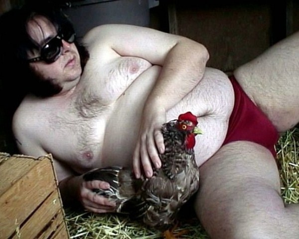 guy having sex with a chicken