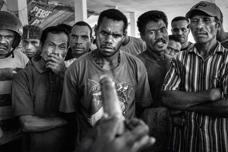 Demonstration of condom usage to men from Jayapura,capital of Papua.