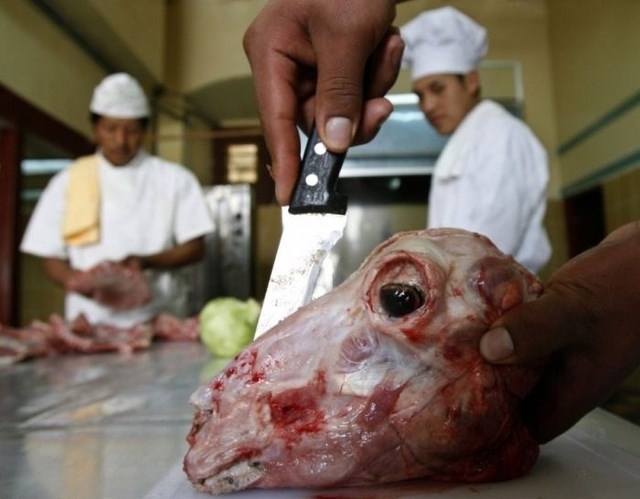 Sheep Head is a delicacy in Bolivia. Here we see a butcher slicing into a boiled head ready to be served. Sheep Head Soup is also a very popular dish in Bolivia.