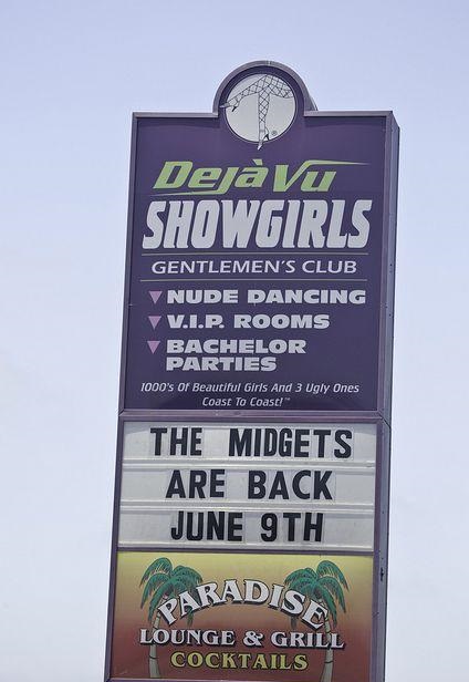 signage - Dejavu Showgirls Gentlemen'S Club V Nude Dancing V V.I.P. Rooms Bachelor Parties 1000's of Beautiful Girls And 3 Ugly Ones Coast to Coast The Midgets Are Back June 9TH Aradis Lounge & Grill Cocktails