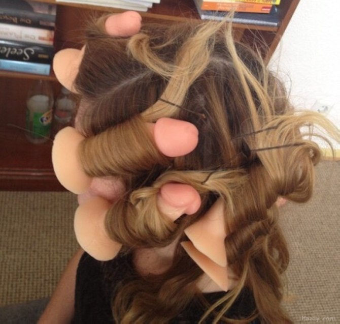 Girl with dildoes in her hair as curlers.