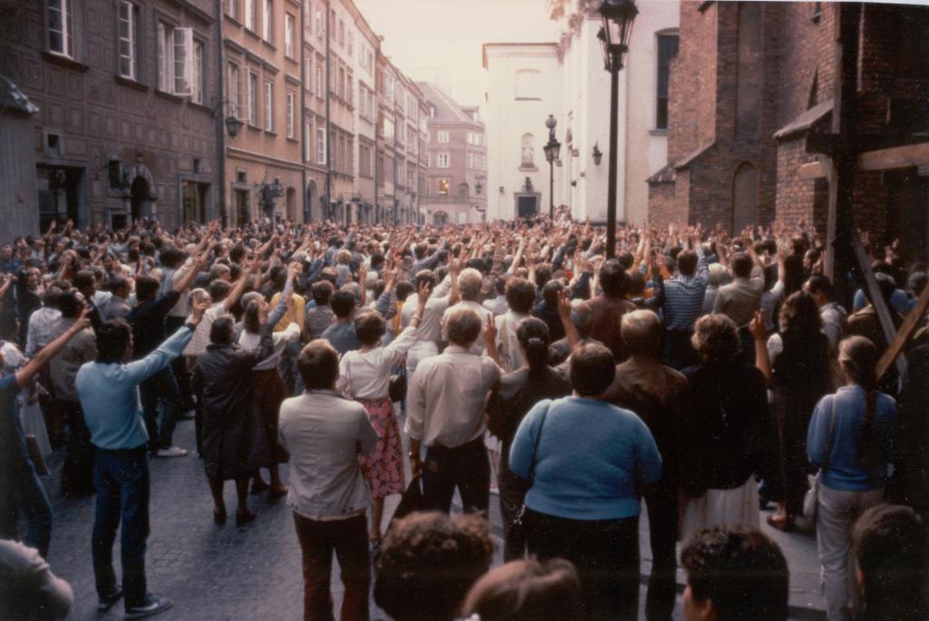 Protesters in Warsaw Poland in 1984. This was the beginning of a 7 year movement known as the Solidarity Movement. They are holding up the peace symbol which also became the symbol of the movement.