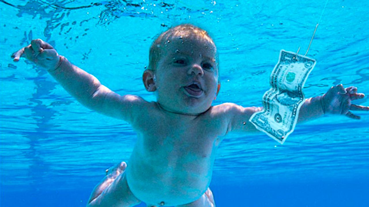 Nirvana’s Swimming Baby - Snapped by photographer Kirk Weddle, the baby depicted on the cover of Nirvana’s influential Nevermind album was the four-month-old son of Weddle’s friends. And he’s not actually swimming. As Weddle explains “The mom was on my left, and blew a puff of air into the child’s face. Then we dunked him in and, bang bang, pulled him out. We did it twice and that was it.” Anything for rock n’roll.
