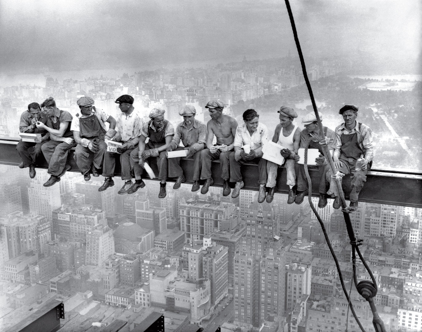 Lunch Atop a Skyscraper -  This famous picture, depicting construction workers having lunch on a girder on top of a skyscraper in Rockefeller Center, New York, is actually a staged publicity photo intended to drum up excitement for the project’s impending completion (I guess construction workers don’t really eat their lunch on steel girders). Still, they really are dangling their feet 850 feet above the ground, harness-free.