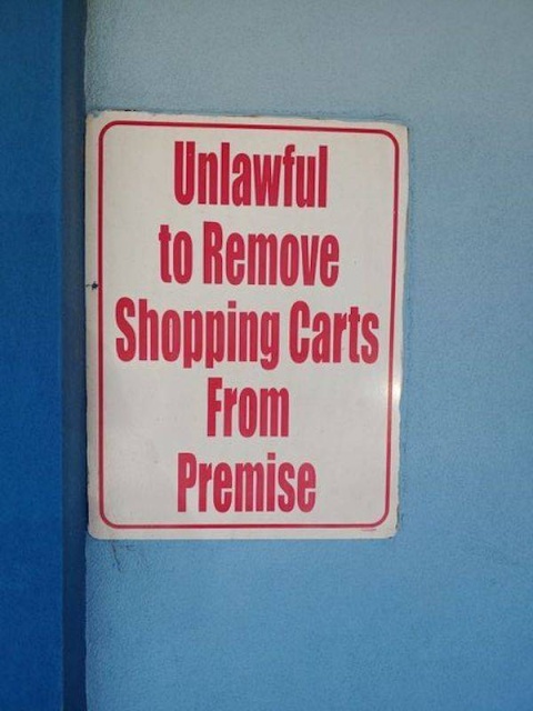 sign - Unlawful to Remove Shopping Carts From Premise