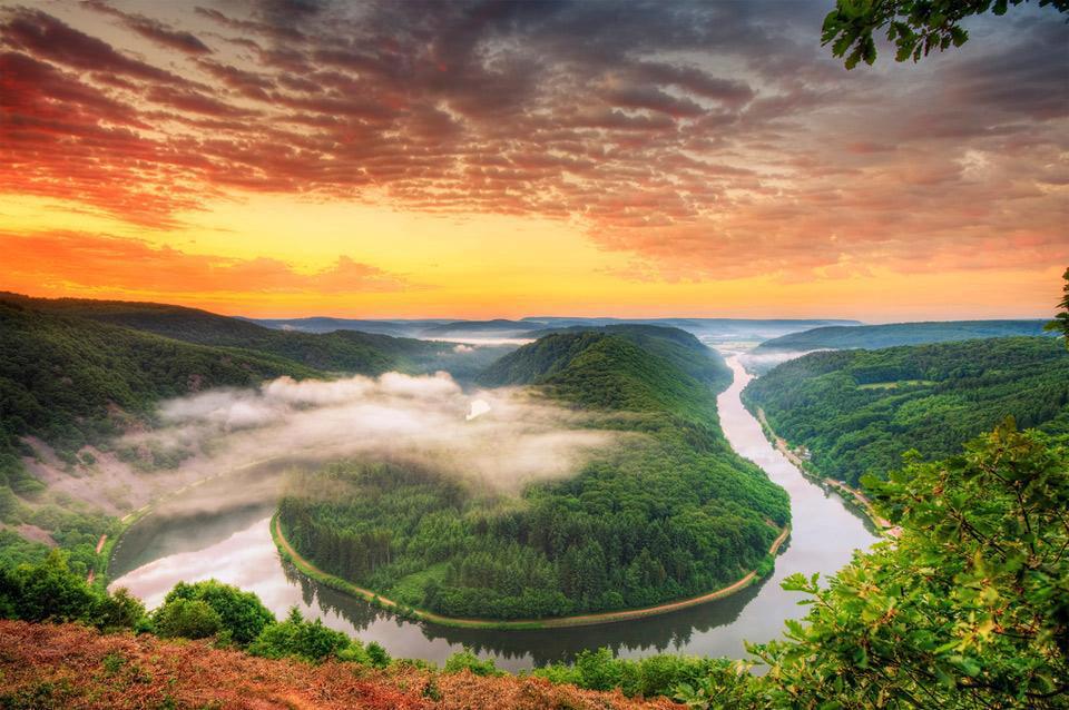 This beautiful sunset is taking place on Saar River in Germany. The lower Saar is a wine growing region, producing mainly Riesling.