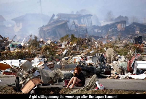 japan tsunami girl - A girl sitting among the wreckage after the Japan Tsunami