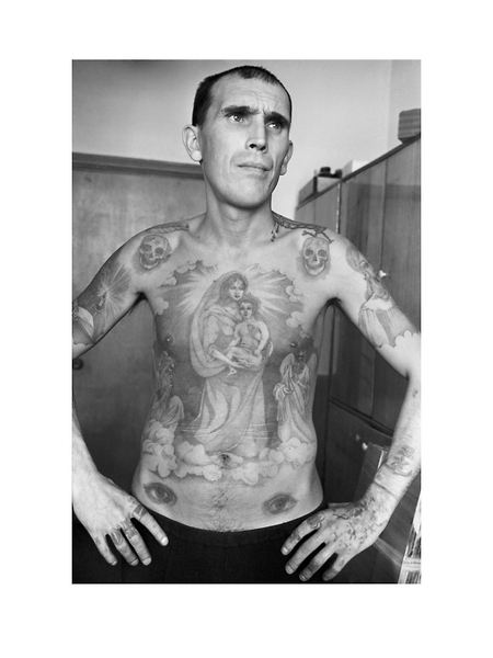 Mikhail Kovanev, poet, artist and musician, was serving a sentence of fifteen years for murder. He claimed he was innocent of this charge. Every part of his body was covered with tattoos, many of his own design. The eyes on the stomach mean that he was a homosexual the penis makes the 'nose' of the face. In the colony he became a drug addict and was subsequently killed