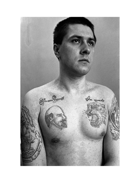 Traditionally tattoos bearing images of Lenin and Stalin were usually tattooed onto the chest, it was a commonly held belief that Communist firing squads were not permitted to shoot at an image of their leaders. Text above Lenin reads Wake up Ilyich Lenin, above the tiger They criminals are getting brazen.