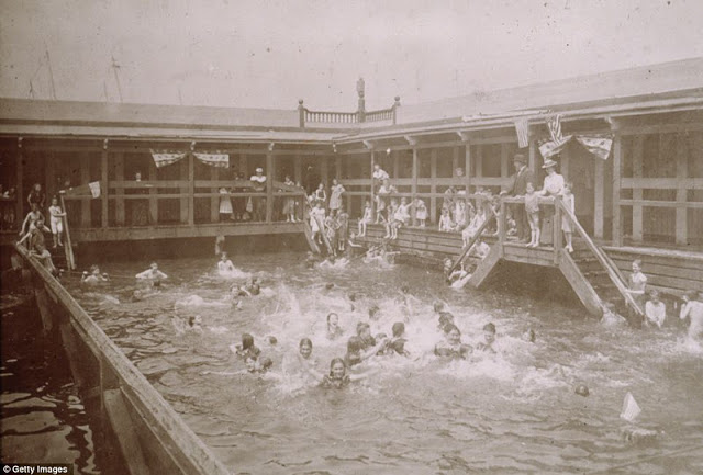 Children swim under the supervision of adults at Public Bath 10, at the Hudson River