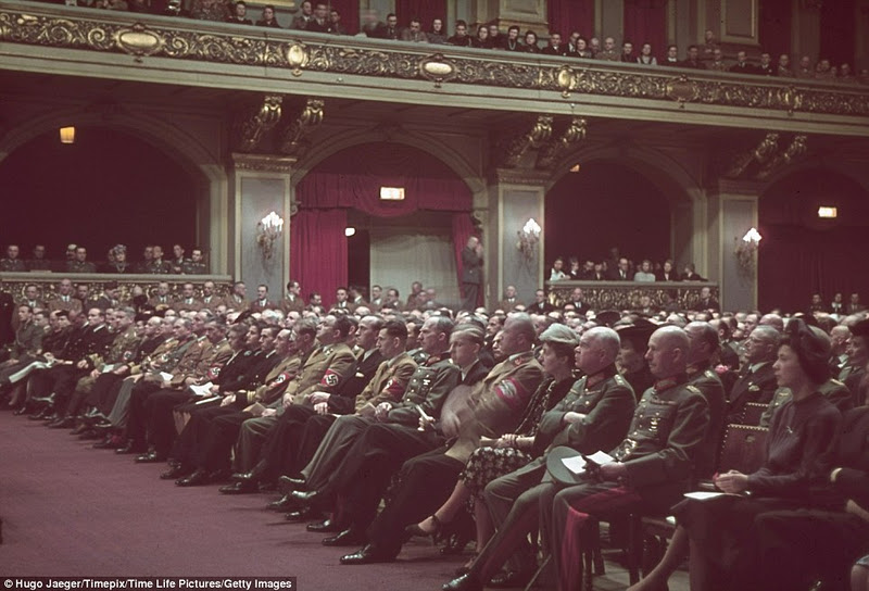Hundreds of Nazi officers and their wives attend a classical music concert for Hitler's 54th birthday in 1943 while across Europe, millions of Jews were being shipped to their deaths in concentration camps
