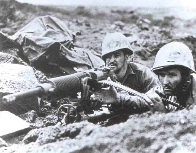 American Marines in hard fighting on Iwo Jima using a captured Japanese machine-gun