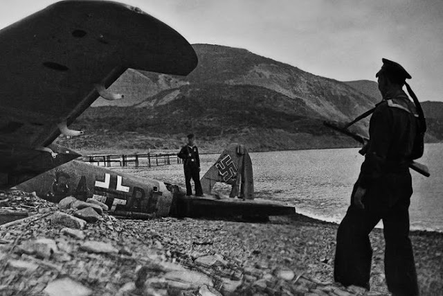 Soviet soldiers pose in front of a crashed Nazi plane after liberating Sevastopol. May 1944
