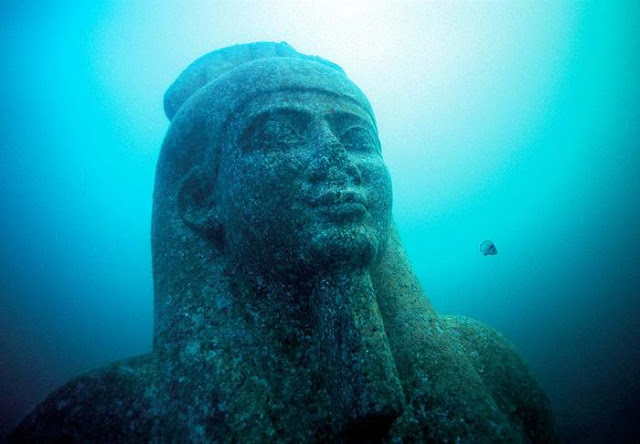 Head of a colossal statue of red granite 5.4 m representing the god Hapi, which decorated the temple of Heracleion. The god of the flooding of the Nile, symbol of abundance and fertility, has never before been discovered at such a large scale, which points to his importance for the Canopic region.