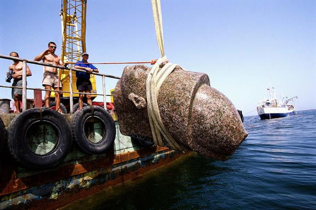 Head of a pharaoh statue is raised to the surface. The colossal statue is of red granite and measures over 5 metres. It was found close to the big temple of sunken Heracleion.