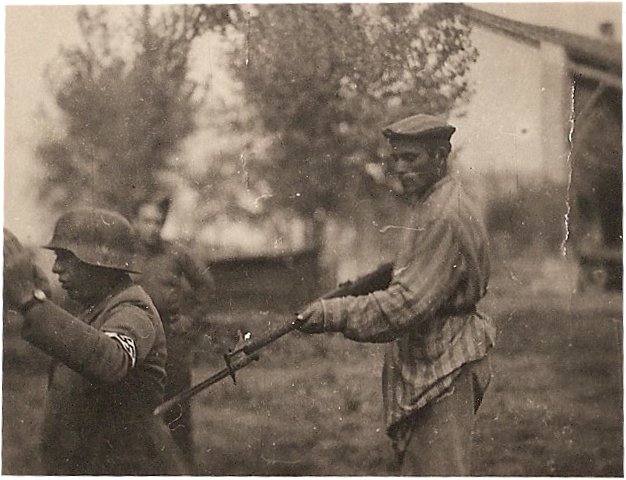 Liberated Jewish man holds NAZI soldier at gunpoint during WWII