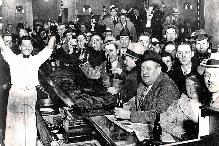 On this day, seventy-nine years ago, citizens in a bar celebrate the end of alcohol prohibition in the United States. December 5, 1933