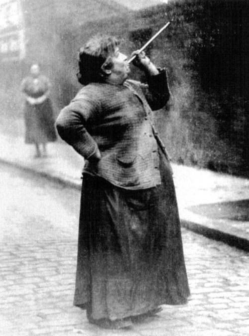 Before alarm clocks there were knocker-uppers. Mary Smith earned sixpence a week shooting dried peas at sleeping workers windows. Limehouse Fields. London