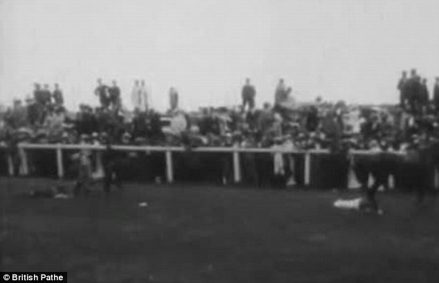 Suffrage: Racegoers are seen craning to get a look after suffragette Emily Davison stepped into the path of King George V's horse at the 1913 Epsom Derby