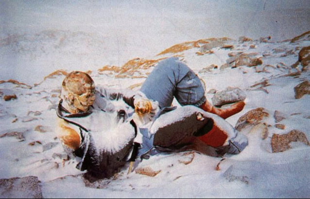 It is assumed that this person died while resting against a snow bank which has since evaporated leaving the body in this odd raised position.