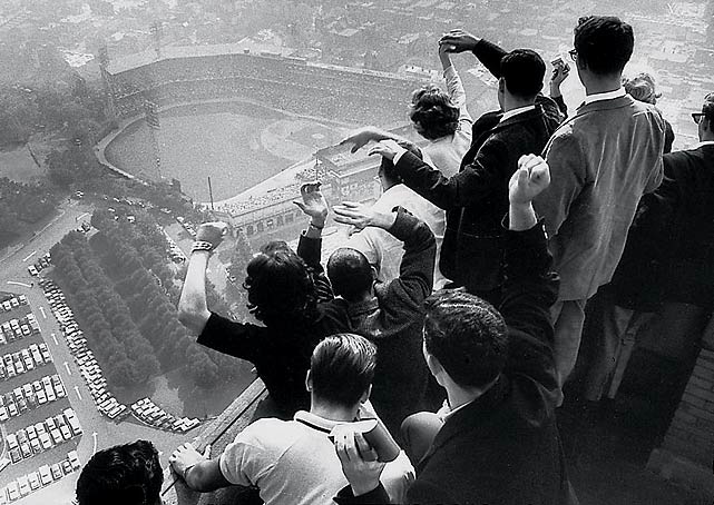 University of Pittsburgh students cheer as they look down on Forbes Field from the top of their campuss Cathedral of Learning as the Pirates are winning their first World Series in 35 years against the Yankees. In Game 7, Bill Mazeroski hit the first walk-off home run in World Series history, a shot over the left-field fence that gave the Pirates a 10-9 win.