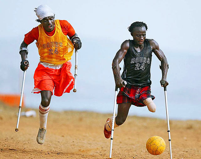 The members of the Single Leg Amputee Sports Club of Sierra Leone chase for the ball in Freetown. A brutal civil war left more than 6,000 amputees in Sierra Leone.