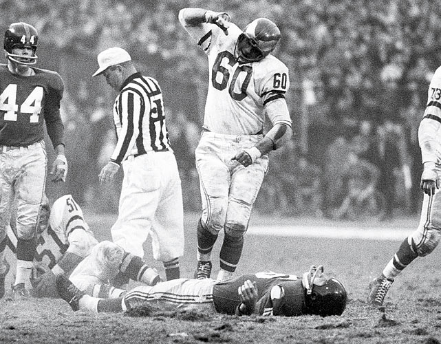 Philadelphia Eagles linebacker Chuck Bednarik celebrates after laying out New York Giants running back Frank Gifford at Yankee Stadium. The hit forced Gifford to temporarily retire from football.