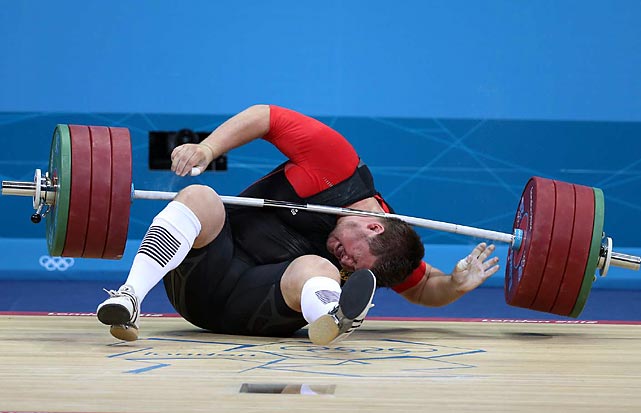 Defending Olympic weightlifting champion Matthias Steiner of Germany lost his balance while trying to lift about 432 pounds and was hit in the neck by the barbell. He got up on his feet and waved to the crowd but later withdrew from the competition.