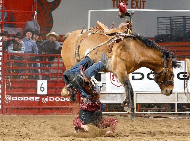 Kyle Whitaker of Chambers, Neb., loses his boot as he is bucked off Dump Wagon at the Circuit Finals Rodeo in Pocatello, Idaho. Whitaker would finish 22nd out of 24 competitors in the saddle bronco riding.