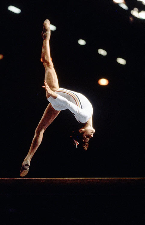 Nadia Comaneci of Romania completes a somersault during the 1976 Summer Olympics in Montreal. Comaneci was the first gymnast to ever be awarded a perfect score in an Olympic gymnastic event, and in total, won three gold medals in Montreal.
