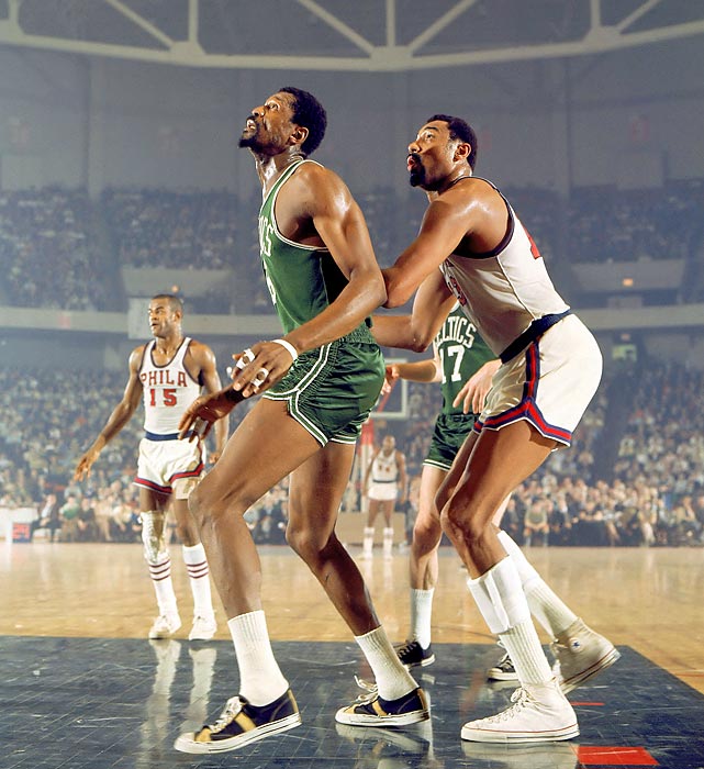Two giants of the NBA, Bill Russell of the Boston Celtics boxes out Wilt Chamberlain of the 76ers during a game in Philadelphia.