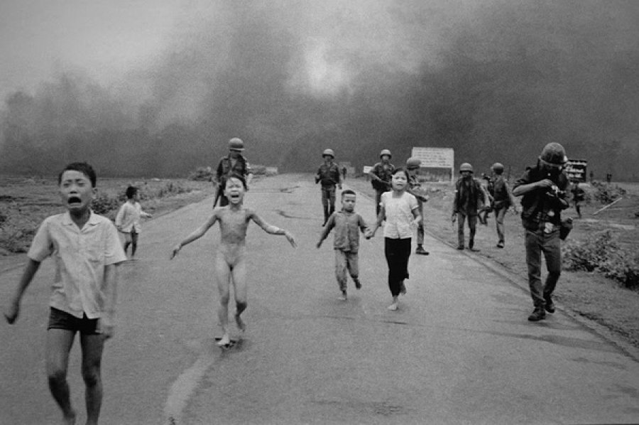 It shows 9-year old girl fleeing from a village in Vietnam, after a napalm bomb was accidentally  dropped on it by a plane of the Vietnam Air Force. The girl survived by tearing off her burning clothes.