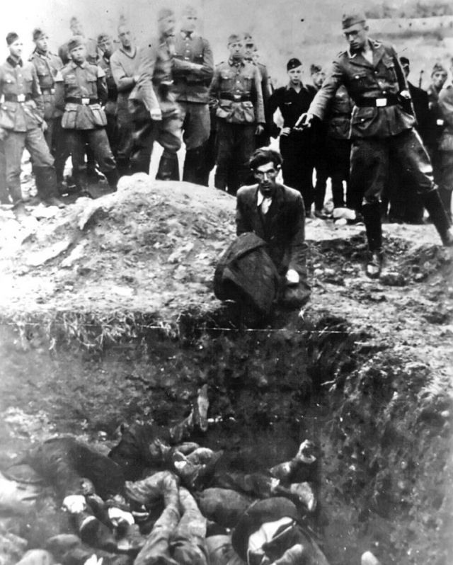 Pictured here in this famous photograph we see a Jewish man, kneeling before a pit filled with bodies, about to be shot by a German soldier. This photograph was found among a German soldiers photo album, and on the back was written the title The Last Jew of Vinnitsa.