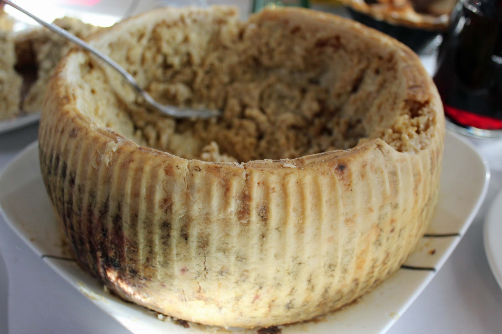 Reason: Casu marzu, a traditional Sardinian cheese, develops when cheese fly larvae are introduced into Pecorino to promote advanced fermentation. As the larvae hatch and eat through the cheese, it softens.