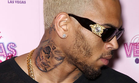Chris Brown's Rihanna beaten face tat