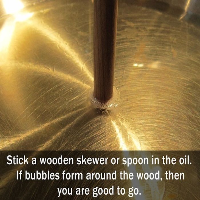 Cooking - Stick a wooden skewer or spoon in the oil. If bubbles form around the wood, then you are good to go.
