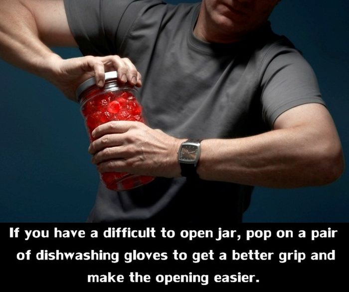 man opening a jar - If you have a difficult to open jar, pop on a pair of dishwashing gloves to get a better grip and make the opening easier.